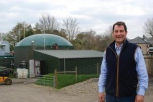Philip Hughes of Hendwr standing in front of his anaerobic digester